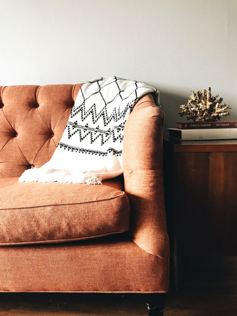 Rust coloured sofa