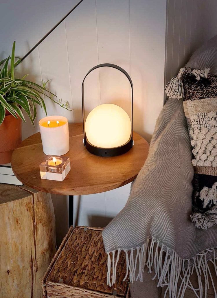 Lamp and Candles on Table - Hygge Concept
